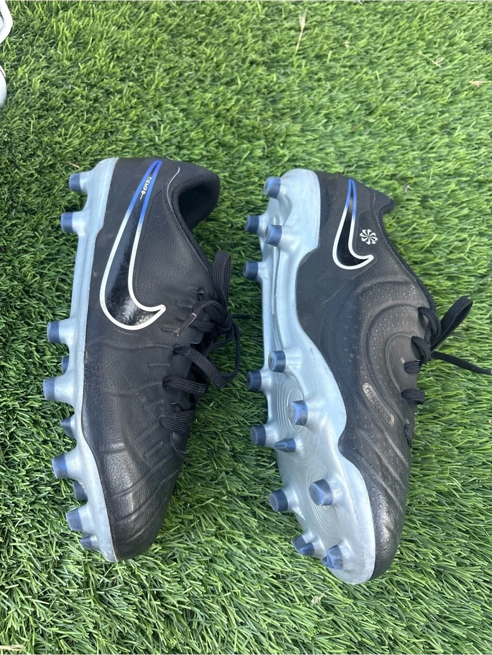 Nike Kids Black Soccer Cleats with Blue Accents